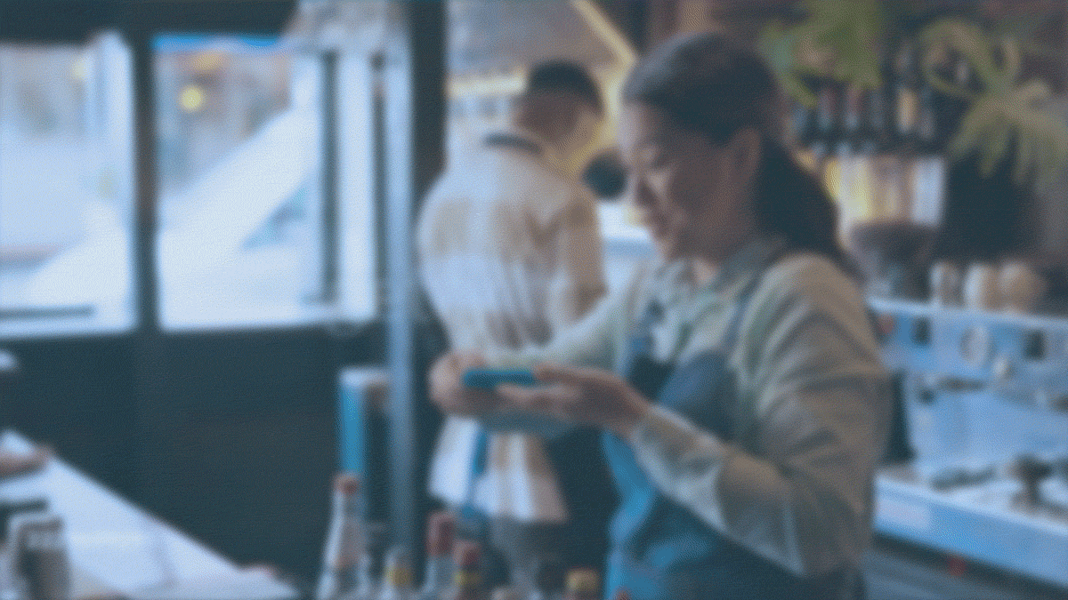 a woman accepts payment with card
